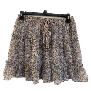Sienna Sky. Extra Small (XS). Blue mini skirt with multiple colored flowers.